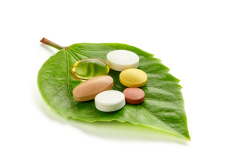 stock-photo-52820000-vitamins-and-pills-on-a-green-leaf